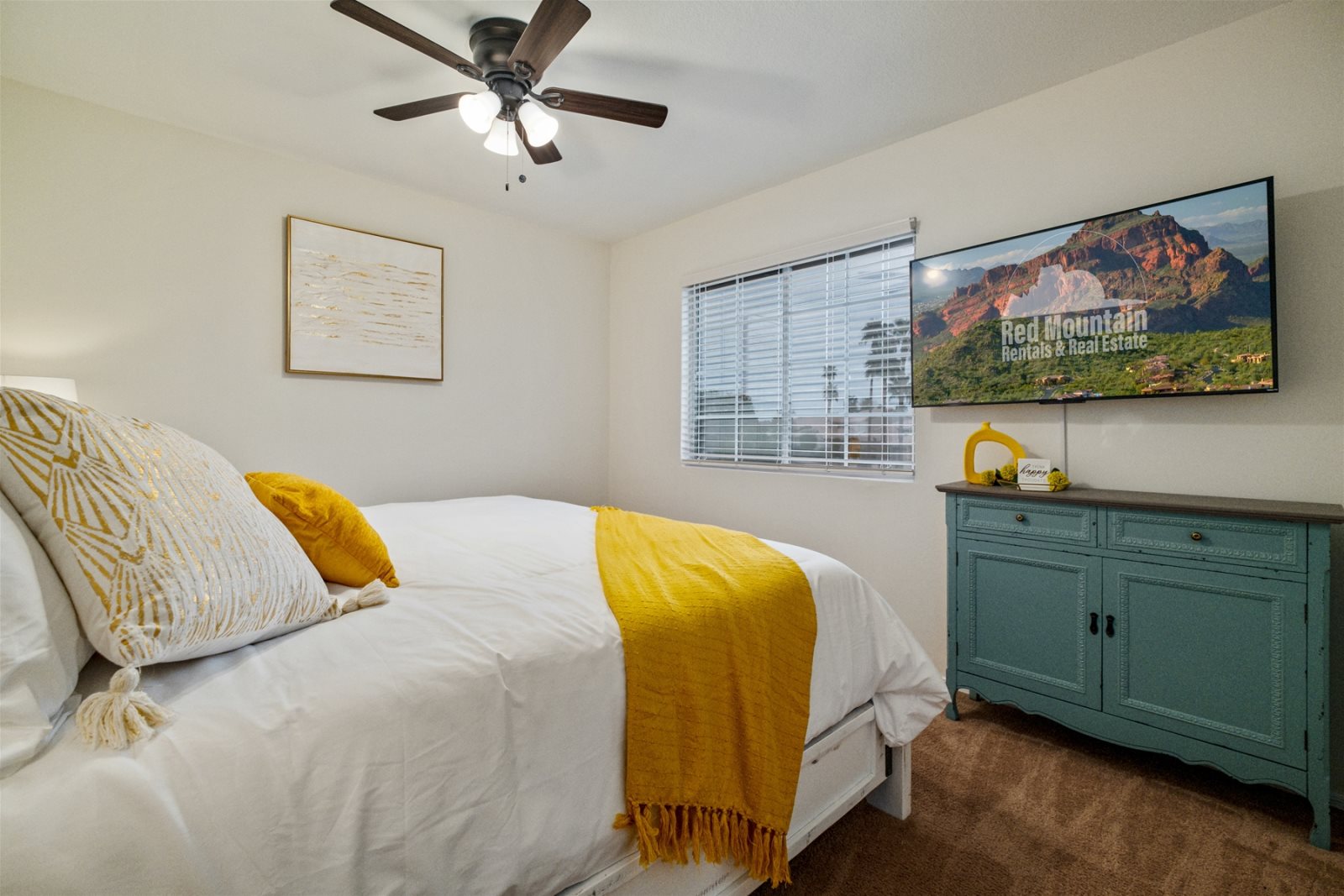 Bedroom 3 is also located upstairs and features a King bed, TV and ceiling fan.