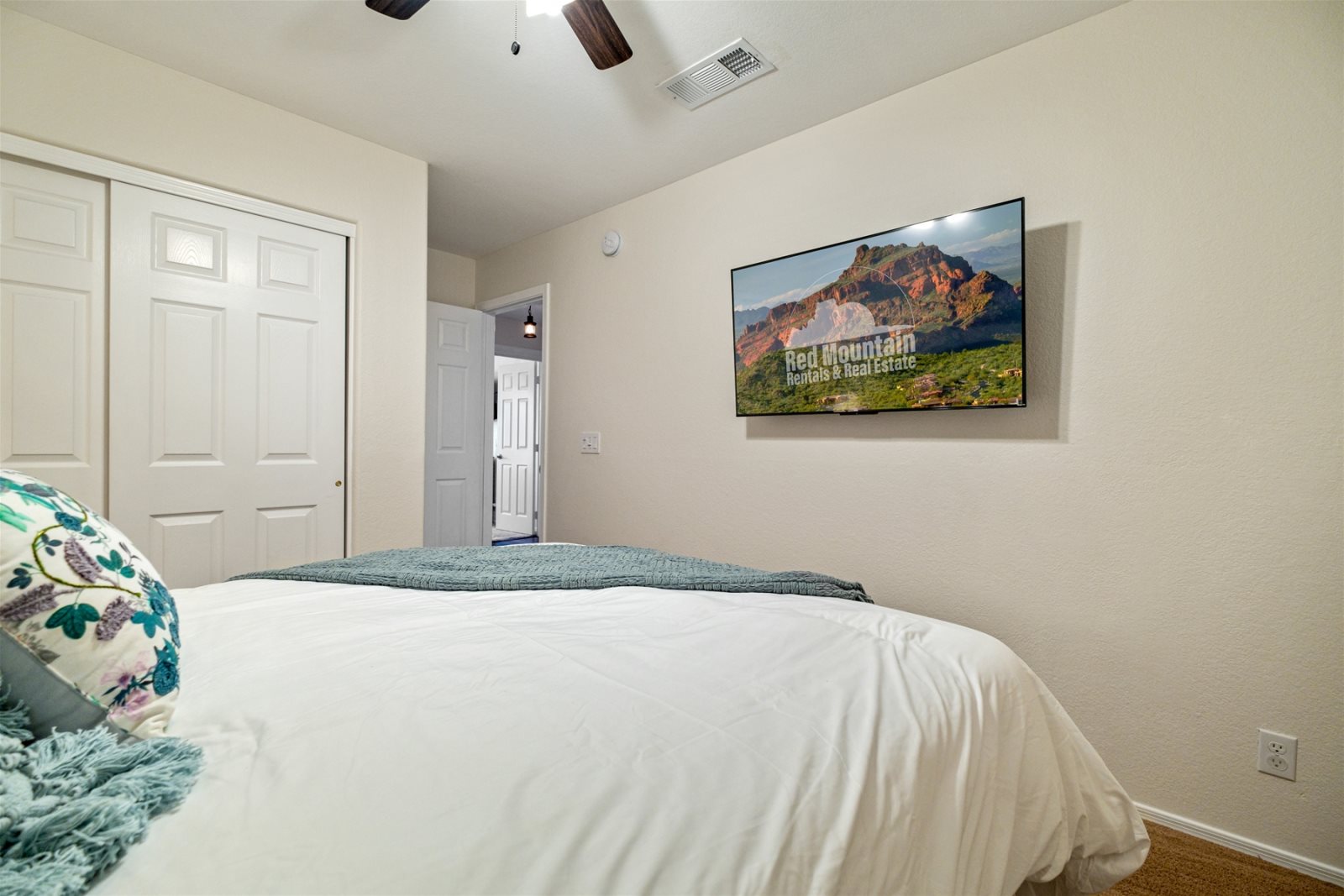 Bedroom 4 is located upstairs with a Queen bed, TV and ceiling fan.