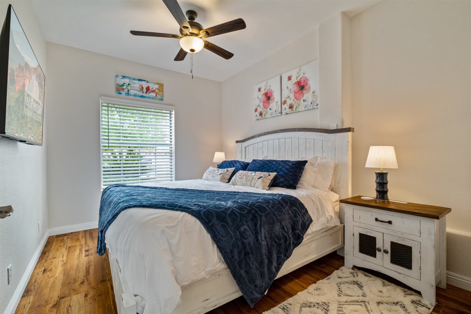 Bedroom 5 is located downstairs.  This room has a King bed, TV and ceiling fan.